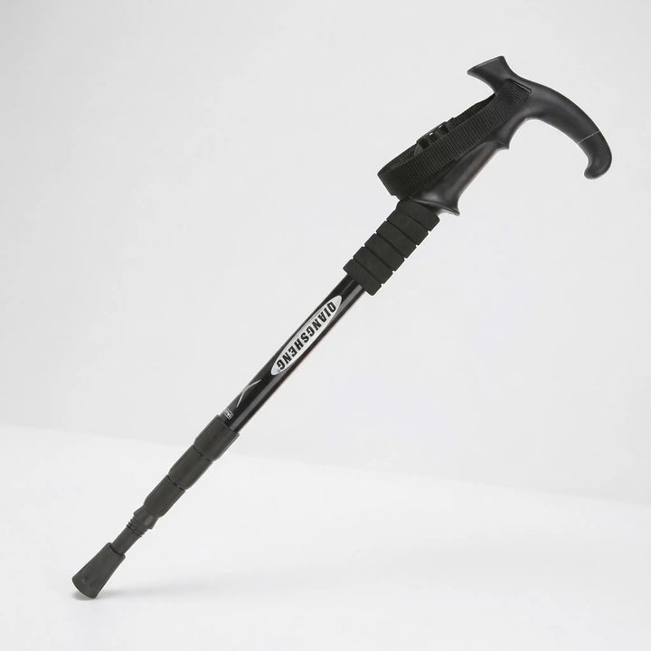 Unisex folding trekking pole, extended & ready for use on trails. Adjustable 4-section hiking support.