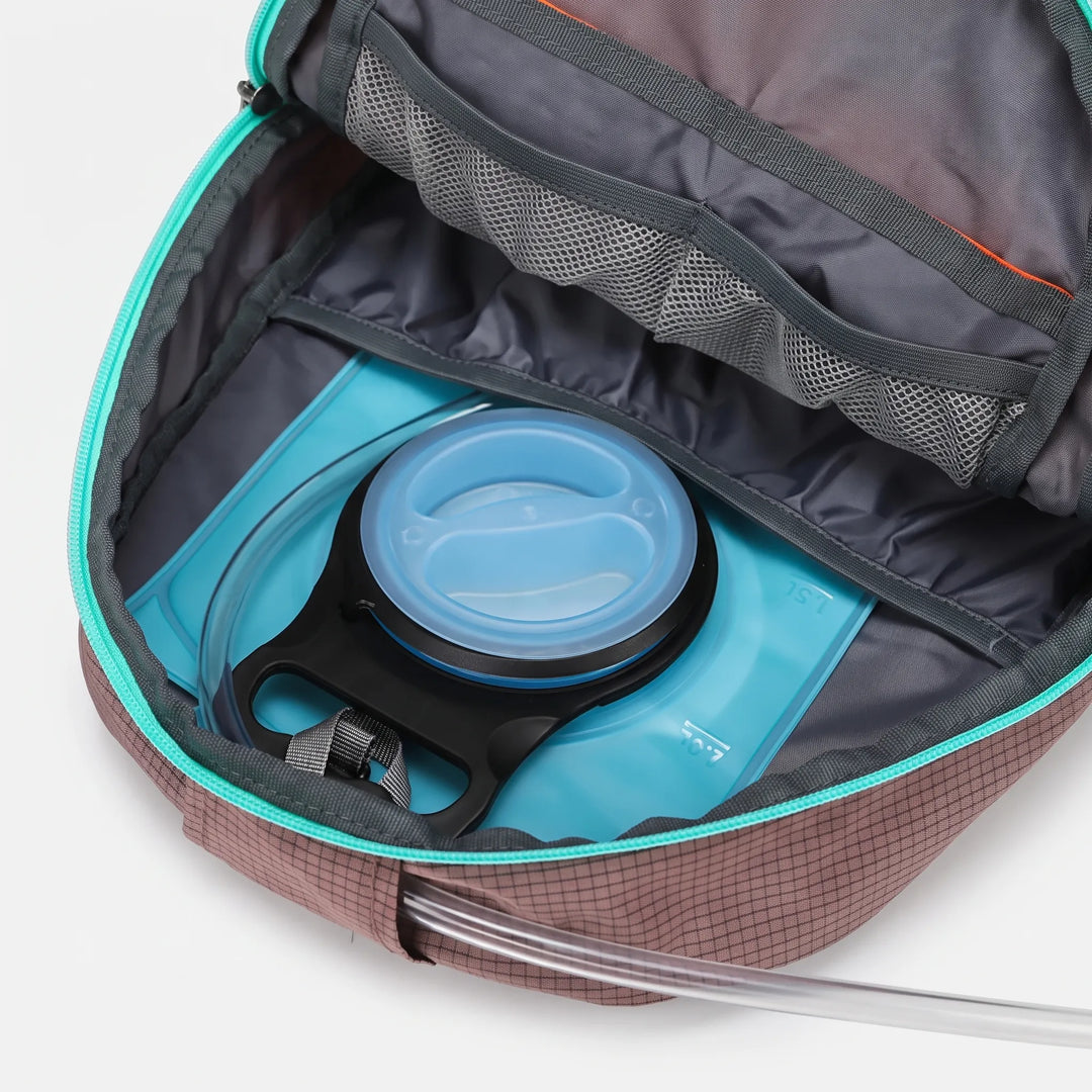 Rugged outdoor gear: Unisex hiking daypack with rain cover, ideal for trails, camping & exploration.