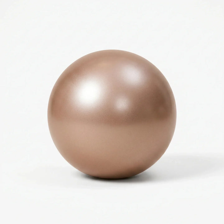 Compact 9-inch PVC mini ball for improving flexibility, balance, and stability in yoga & Pilates.