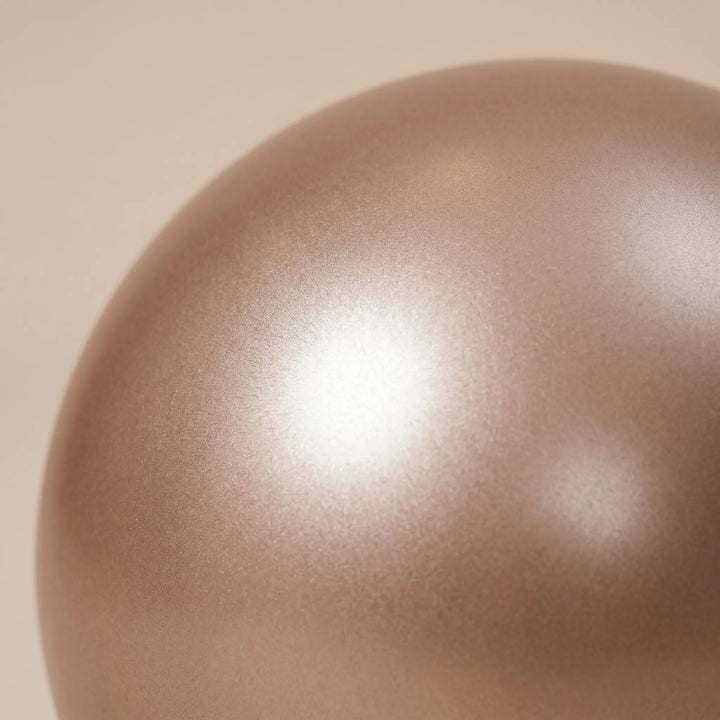 Small 9-inch Pilates ball for targeted core workouts, home fitness, and muscle strengthening exercises.