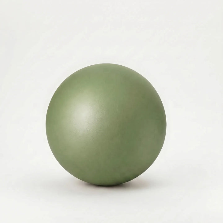 Portable 9-inch PVC mini fitness ball for yoga, Pilates, and core strength home workouts.