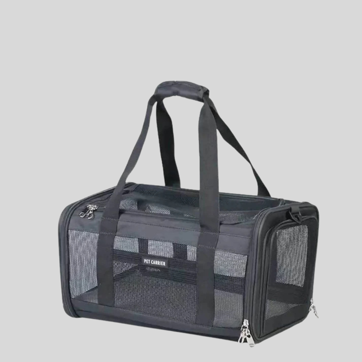 Foldable black airline approved pet carrier with soft bedding and ample ventilation for safe cat and dog travel.