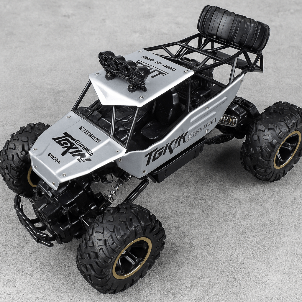 Unisex All-Terrain RC Monster Truck tackling a rocky path. Perfect off-road toy for kids & adults.
