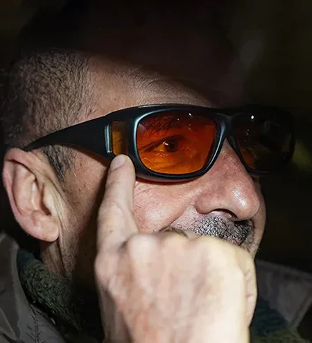 Unisex anti-glare night driving glasses enhancing clear vision & road safety.