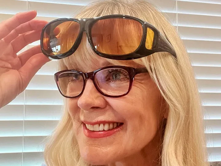 Unisex night vision aid glasses for improved clear vision and road safety while driving.
