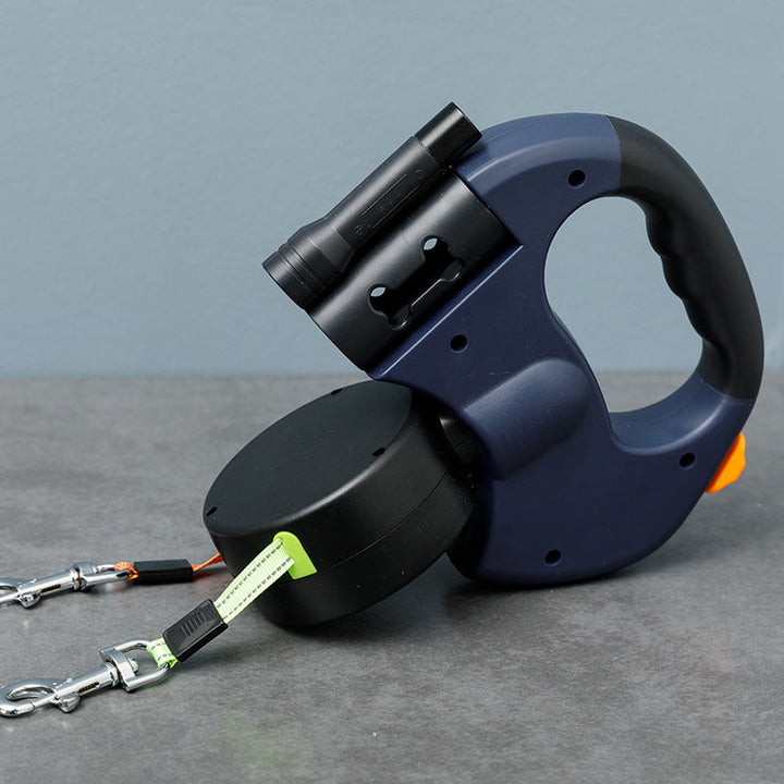 Two dogs happily walking on an anti-tangle double dog leash with visible LED light for safety.