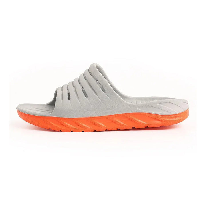 Pain relief footwear: unisex arch support slides with orthopedic support, designed for tired feet and foot recovery.