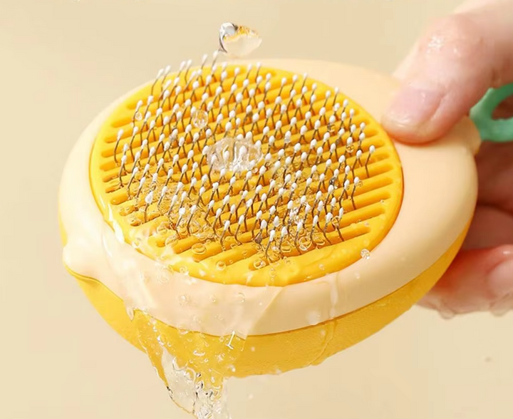 Green and yellow avocado detangling brush for unisex hair care, also suitable for scalp massage.