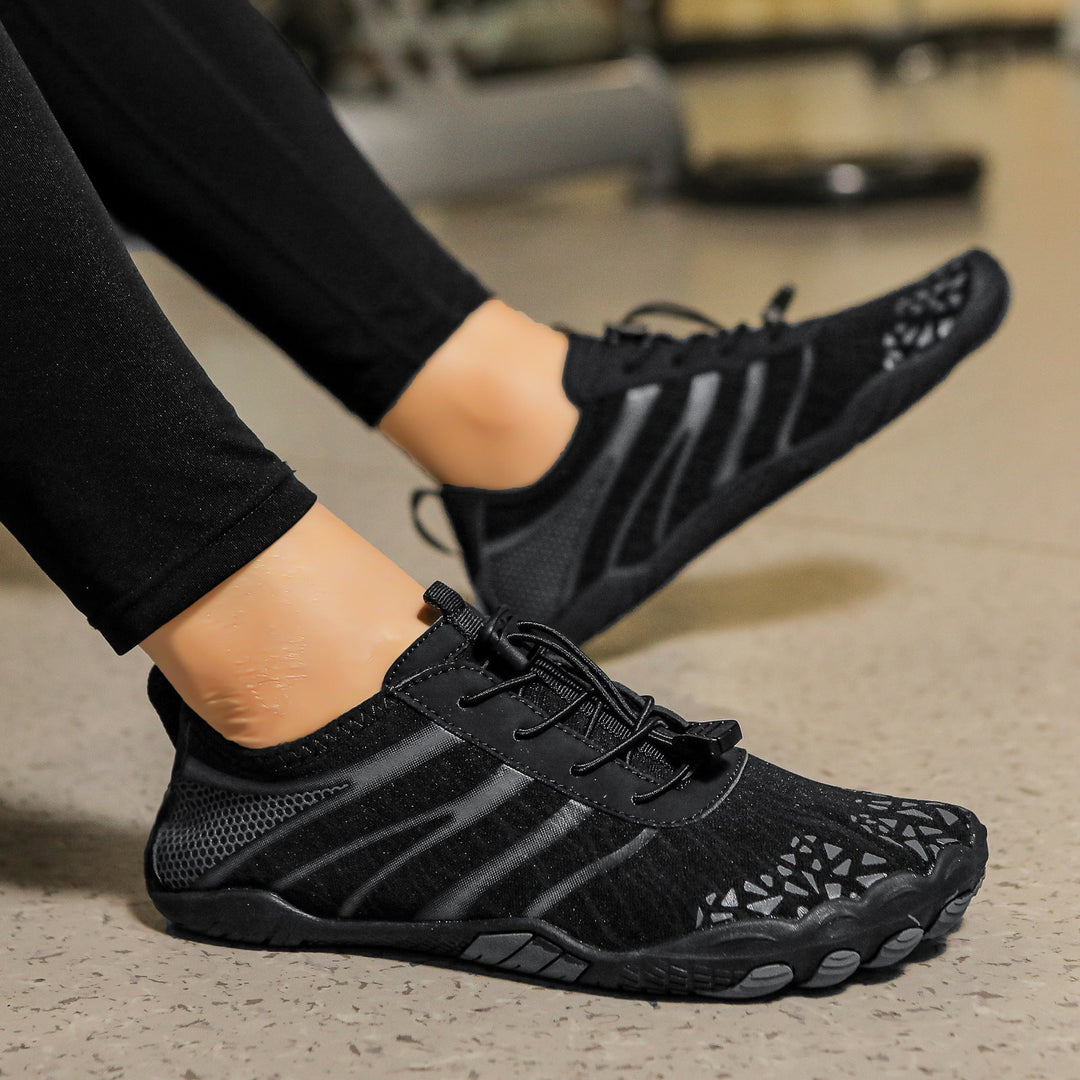 Pair of unisex barefoot walking shoes, flexible & non-slip, designed for natural movement & comfort.