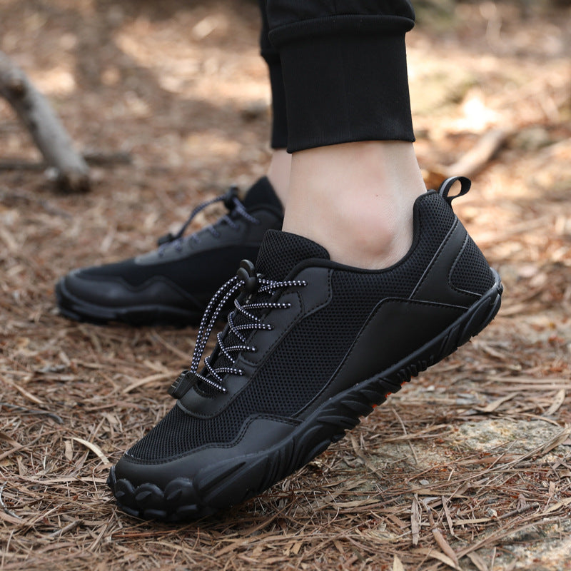 Barefoot hiking trainers on a trail, highlighting their non-slip grip and suitability for rugged outdoor terrain.