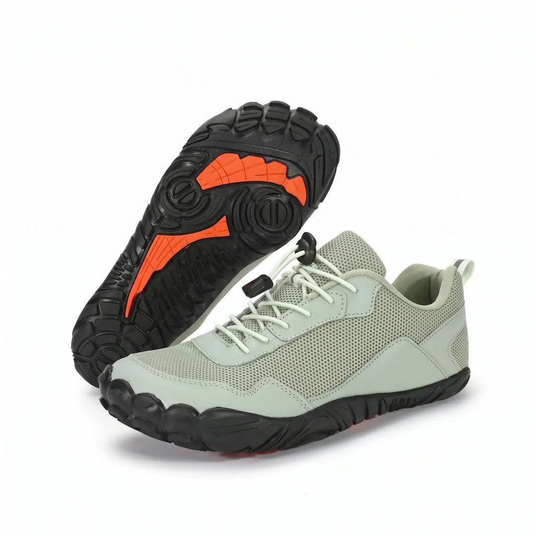 Side profile of a unisex barefoot hiking trainer, showcasing its minimalist design and flexible sole.