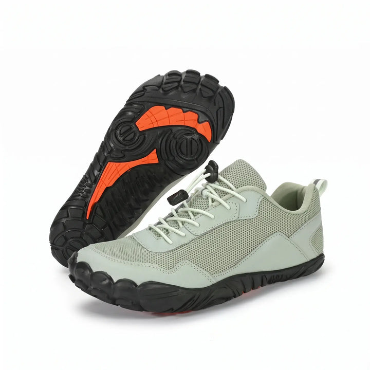 Side profile of a unisex barefoot hiking trainer, showcasing its minimalist design and flexible sole.