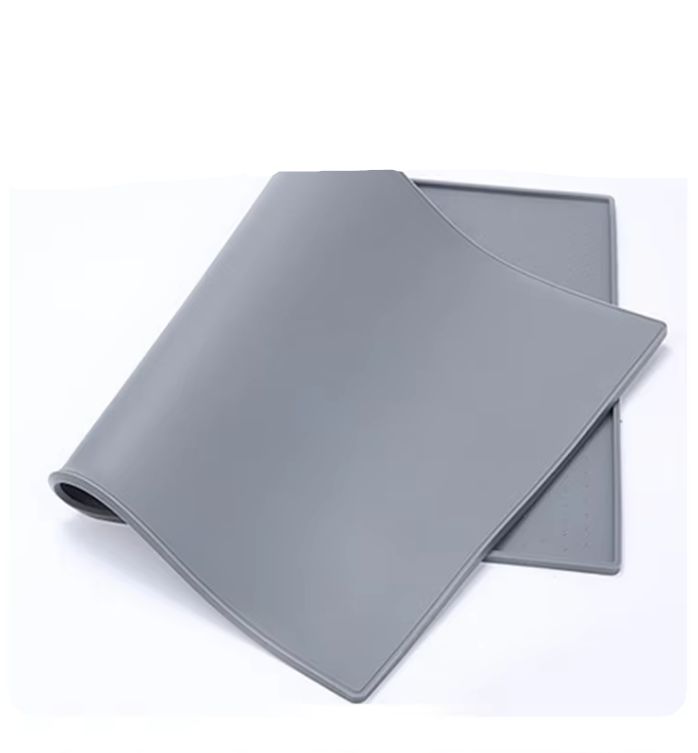 Durable pet feeding mat with stainless steel dog and cat bowls, non-slip base