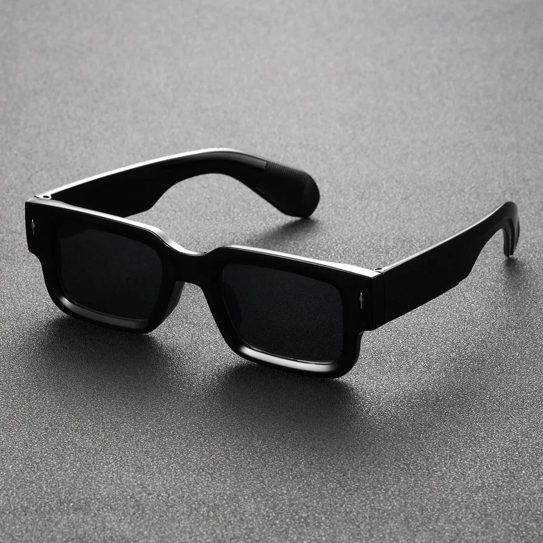 Stylish unisex model wearing bold rectangular sunglasses, a trendy fashion statement for sun.