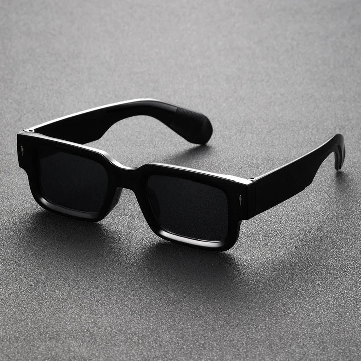 Stylish unisex model wearing bold rectangular sunglasses, a trendy fashion statement for sun.