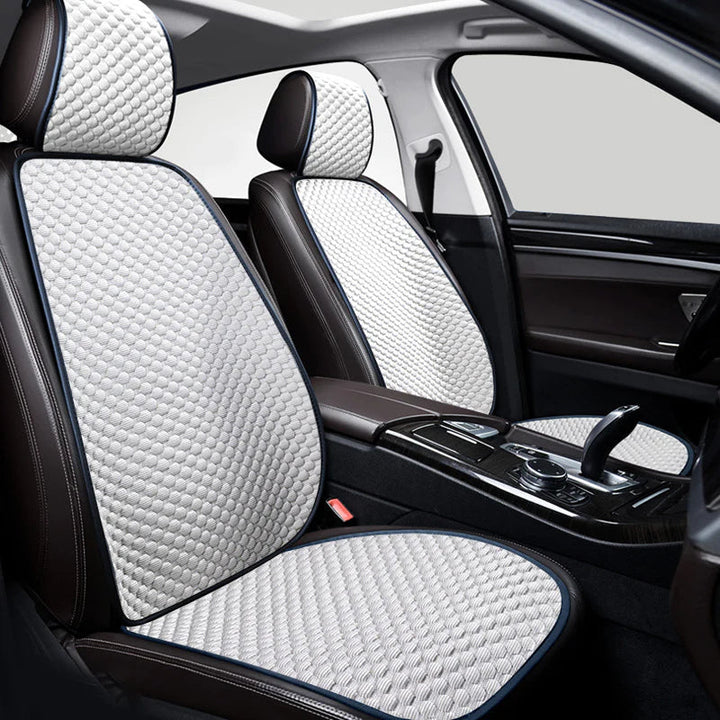 Universal fit car seat protector in a vehicle, demonstrating its easy installation and anti-slip backing.