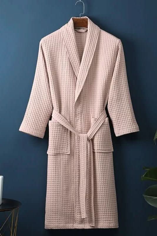 Soft white waffle knit bathrobe, perfect for post-shower loungewear and spa relaxation.