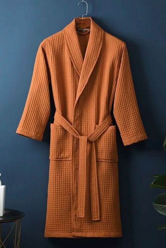 Close-up of soft, breathable cotton waffle texture on a luxurious spa bathrobe.