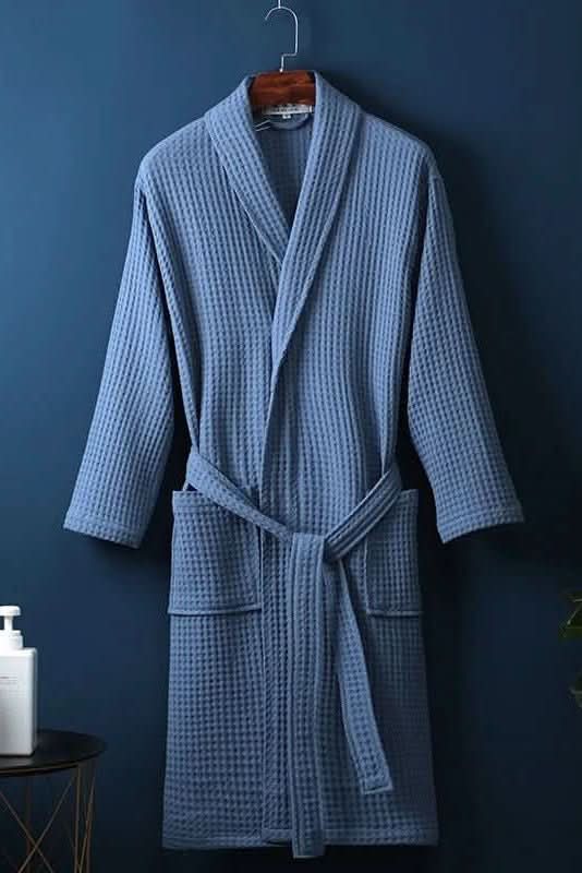 Person wearing a cozy unisex breathable waffle bathrobe, enjoying post-shower loungewear.