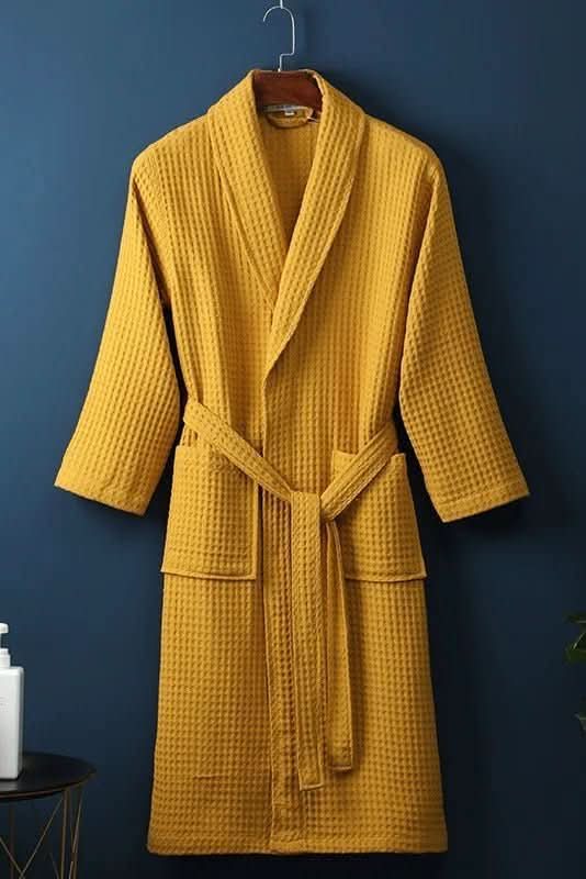 Crisp white cotton waffle bathrobe, a breathable unisex spa robe for daily relaxation.
