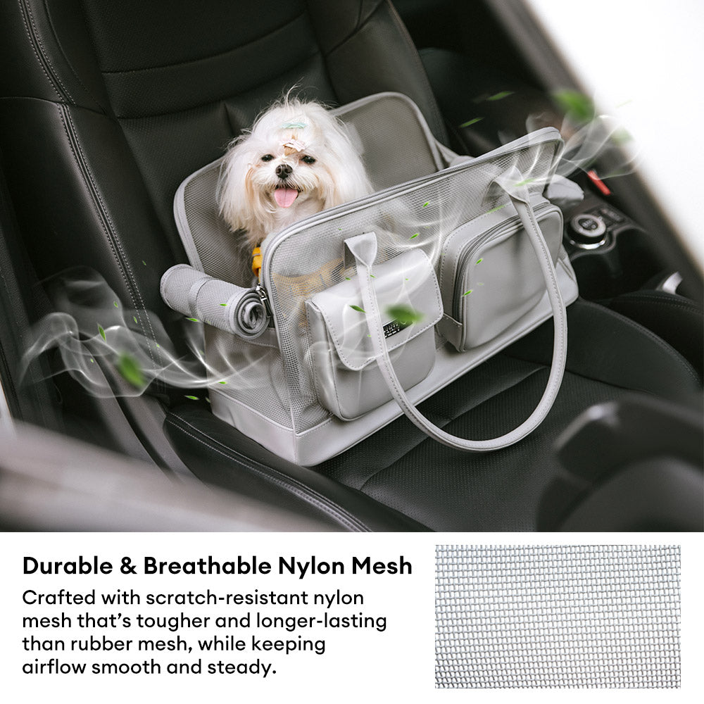 Cat resting inside a comfy mesh pet carrier, black and grey, well-ventilated unisex design