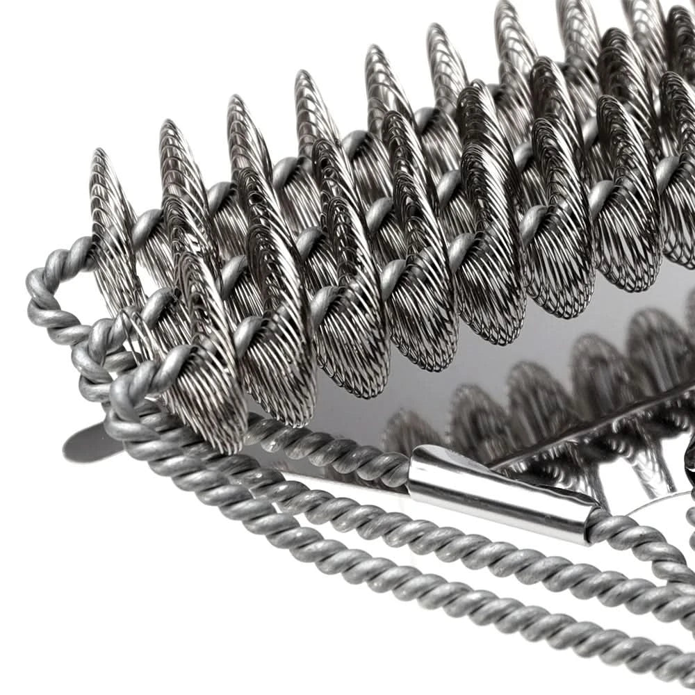 Person using a bristle-free stainless steel grill brush to safely clean a hot BBQ grate. Grill accessory.