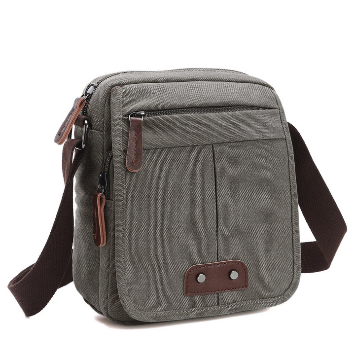 Durable canvas crossbody bag for unisex use. Features multiple pockets for superior organization. Ideal for travel.