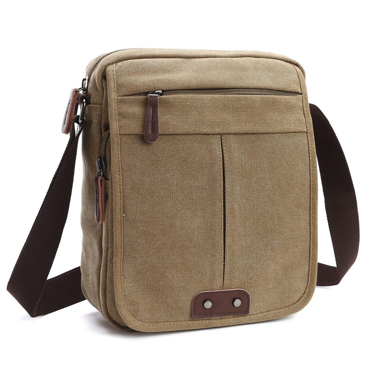 Casual unisex canvas crossbody bag, ideal for everyday carry. Features multiple pockets for organized storage.