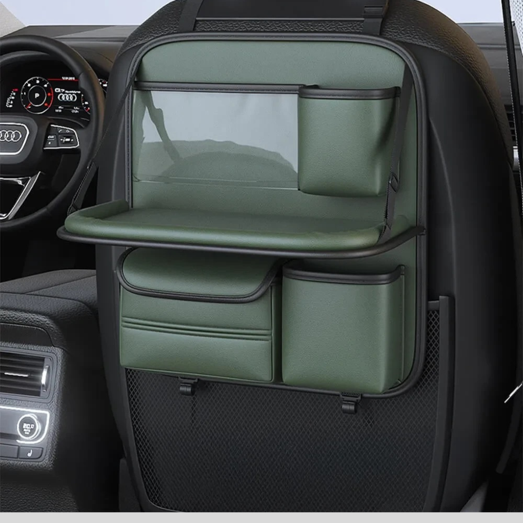 Car seat back organizer in use with tablet holder, cup holder, and open foldable tray for road trip dining