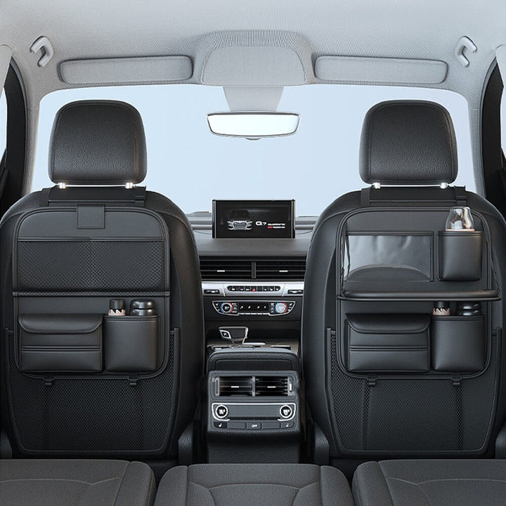 Overhead shot of car seat back organizer with snacks and drinks on foldable tray, perfect for road trips