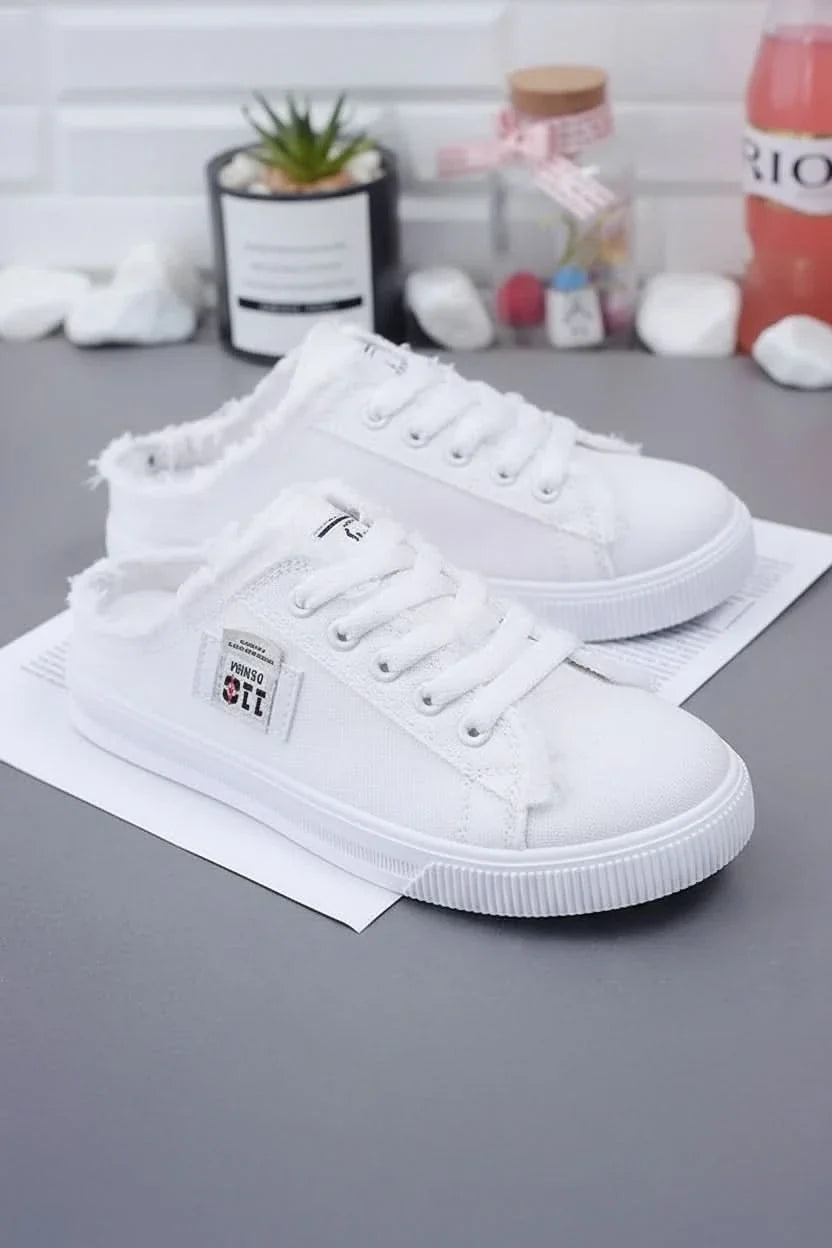 Close-up of unisex high-top lace-up sneakers, highlighting quality, comfort, and casual style.