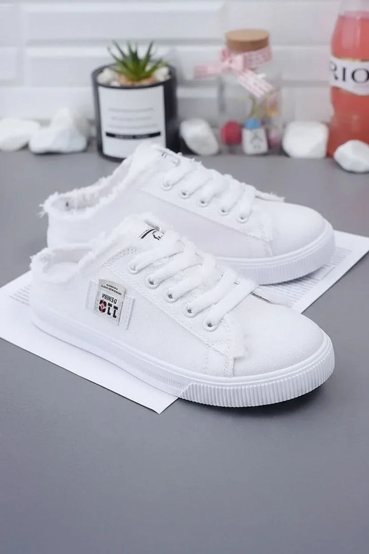 Close-up of unisex high-top lace-up sneakers, highlighting quality, comfort, and casual style.