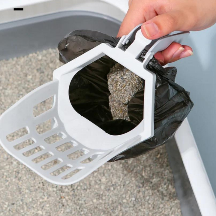 Efficient cat cleaning: litter box cleaner with integrated poop bag, a hygienic pet tool for cats.