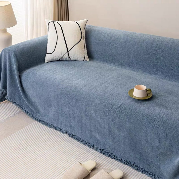Close-up of chenille herringbone fabric on sofa slipcover, showcasing texture and quality