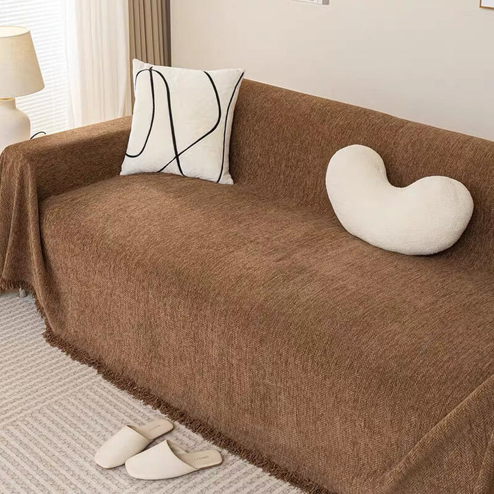 Detail shot of corner on chenille herringbone sofa slipcover, snug fit furniture cover, home decor accent