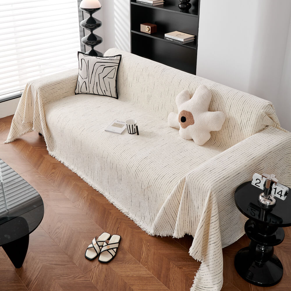 Unisex chenille sofa cover shown with decorative pillows, providing a complete living room refresh