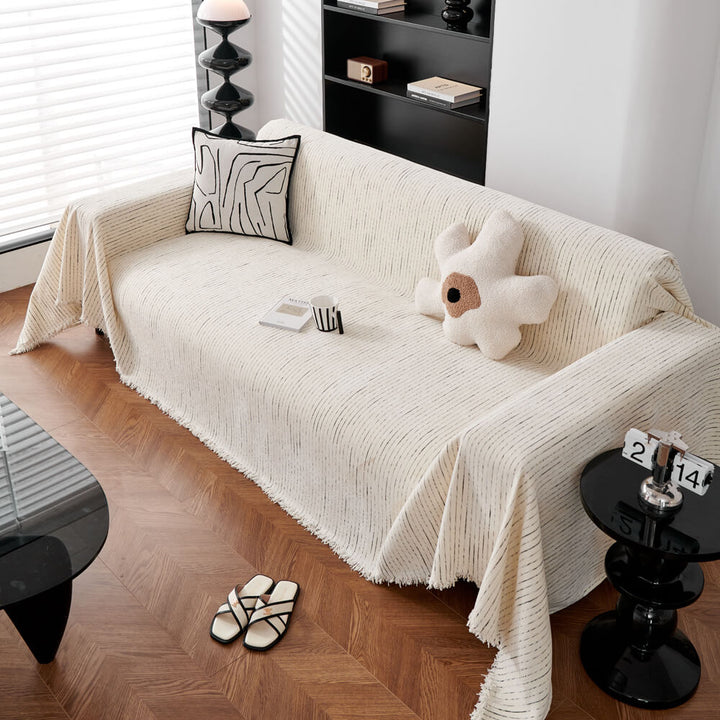Unisex chenille sofa cover shown with decorative pillows, providing a complete living room refresh