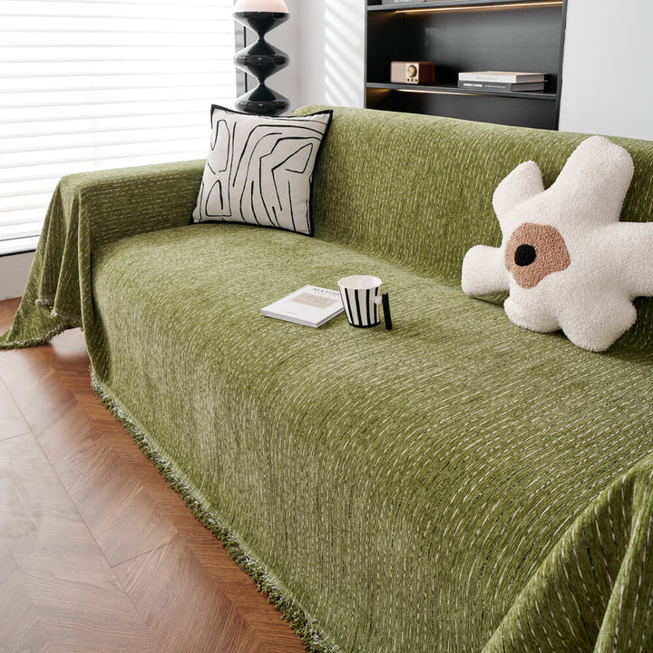Close-up of the soft, textured chenille fabric of a sofa cover, ideal for pet-friendly home decor
