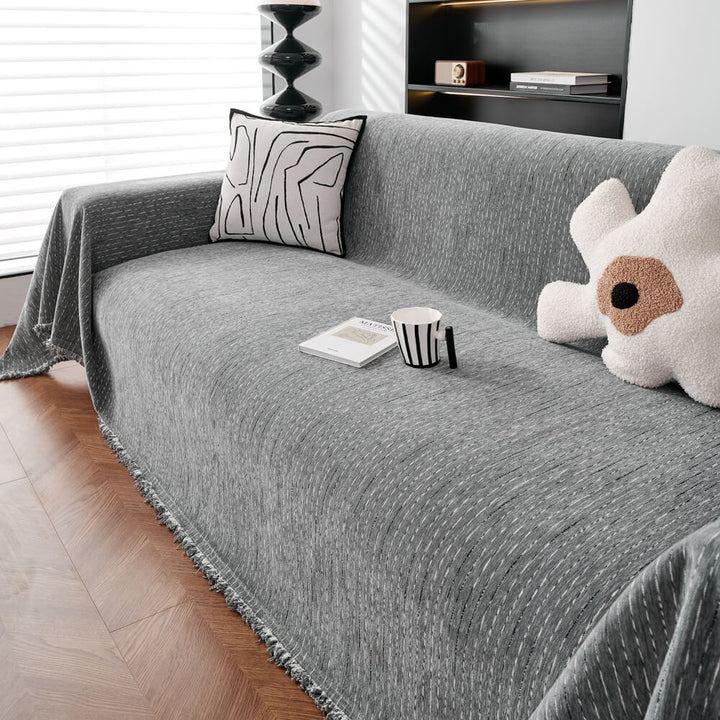 Elegant chenille couch throw protecting a living room sofa, showcasing its all-season durability