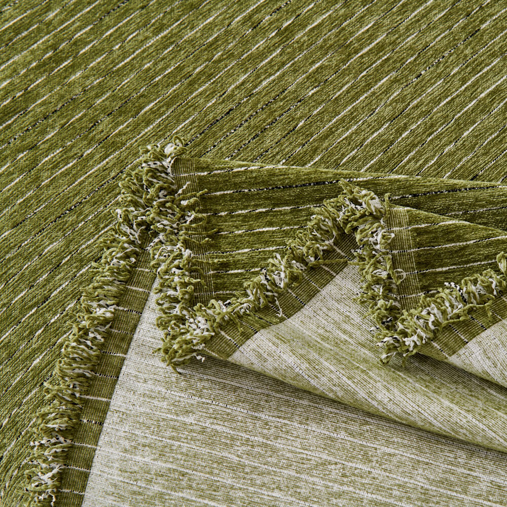 Luxurious chenille sofa cover draped artfully, perfect for all-season use and adding warmth to a room