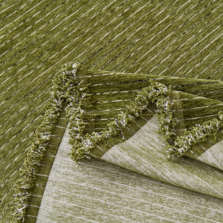 Luxurious chenille sofa cover draped artfully, perfect for all-season use and adding warmth to a room