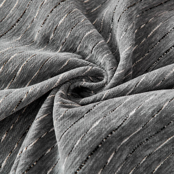 Detail of the border of a unisex chenille sofa cover, highlighting its quality and home decor appeal