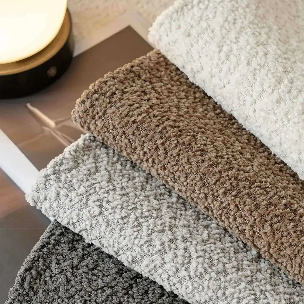 Detail of the non-slip backing on a chenille pet-proof couch cover, ensuring secure furniture protection