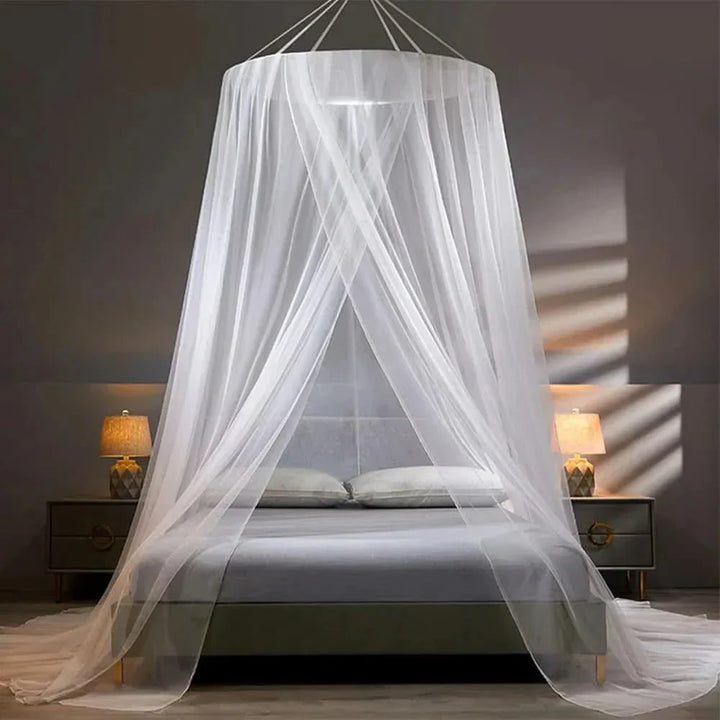 Child sleeping soundly under a safe, collapsible mosquito net. Provides essential bug-free insect protection.