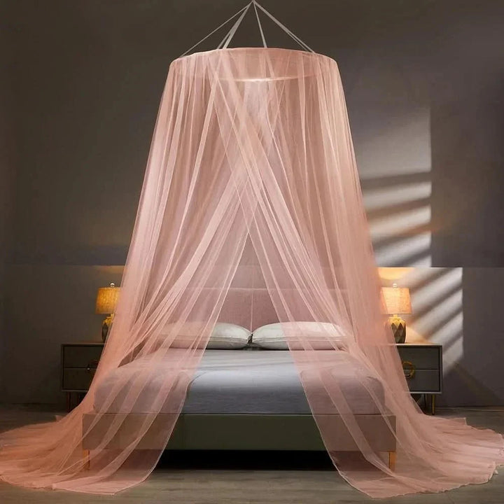 Adult enjoying peaceful, bug-free sleep in a spacious unisex collapsible mosquito net. Great home decor solution.