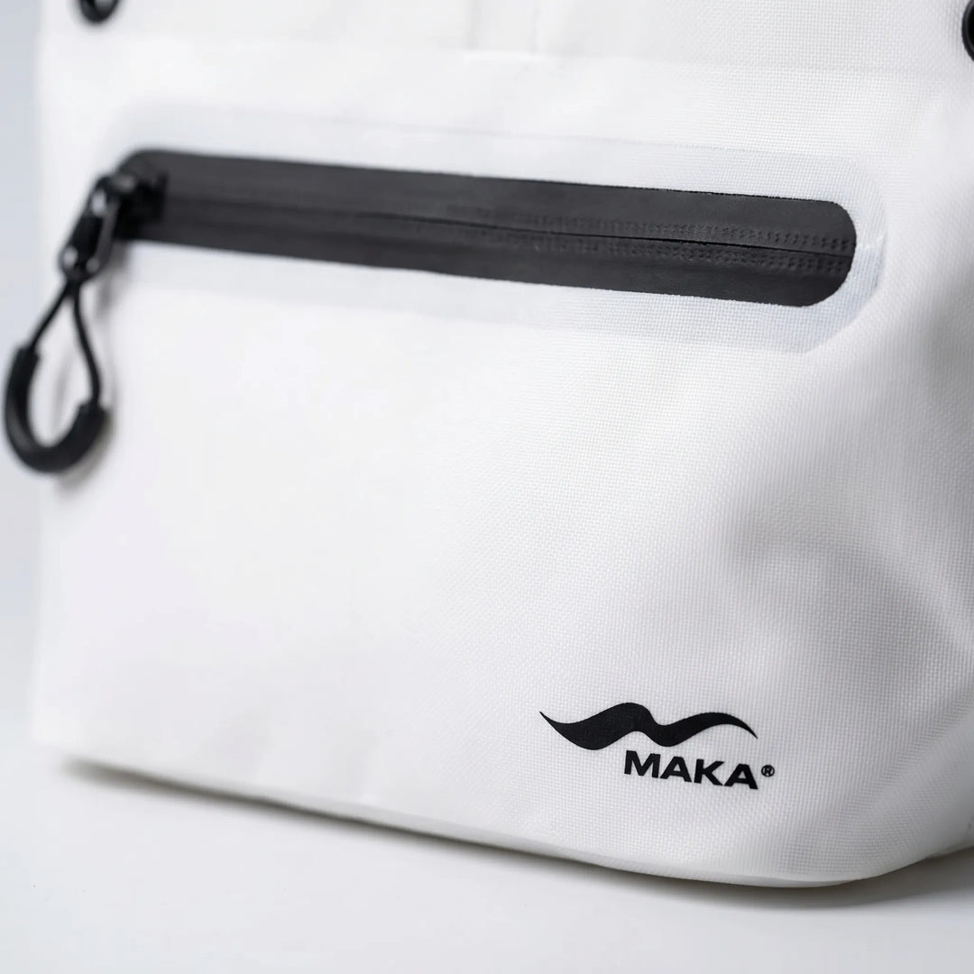 Compact crossbody dry bag, water-resistant, protecting travel essentials from water.
