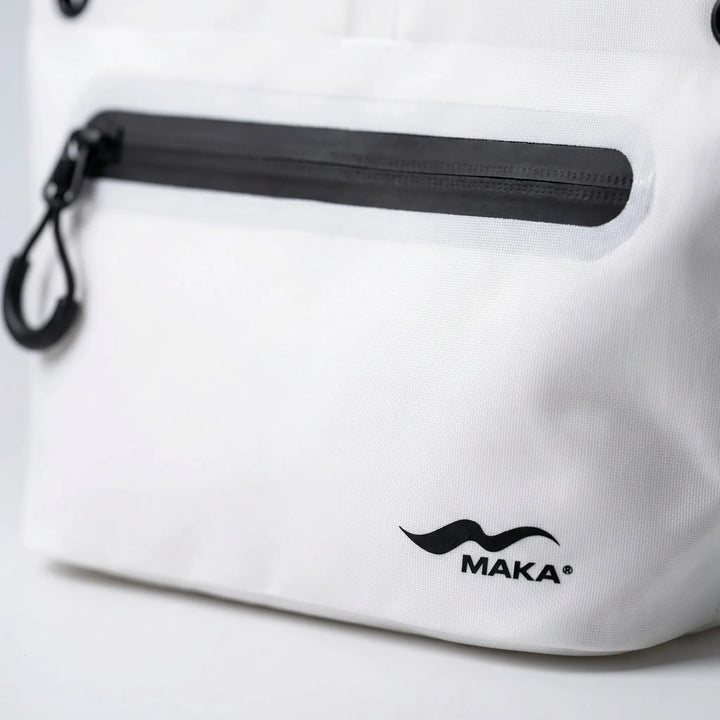 Compact crossbody dry bag, water-resistant, protecting travel essentials from water.