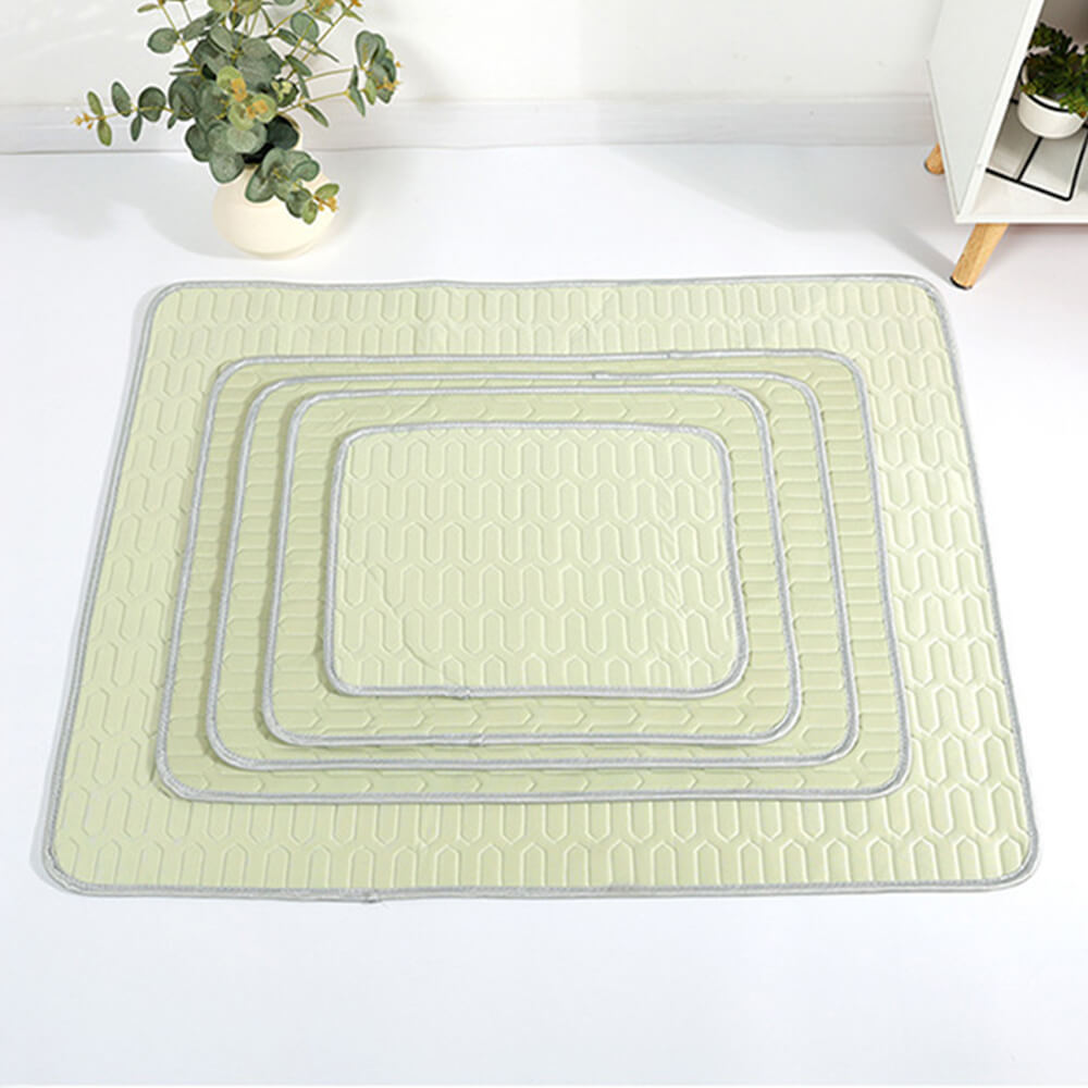 A dog napping peacefully on a blue cooling pet mat, breathable and comfortable