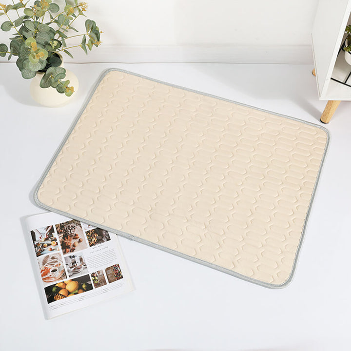 A cat relaxing on a cooling pet mat, icy silk keeping it cool during warm weather