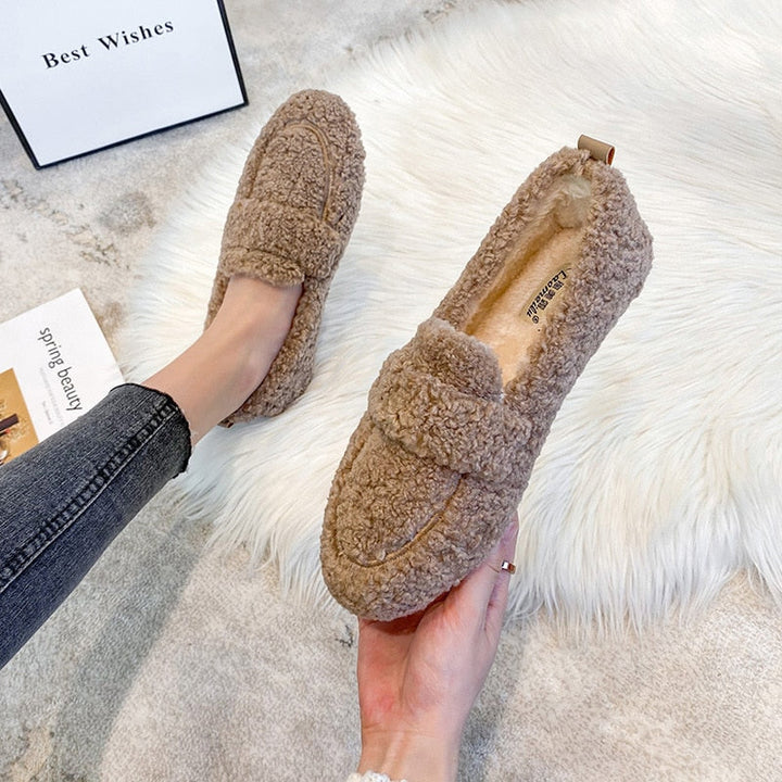 Warm unisex house shoes for fall and winter, featuring a comfortable, soft interior.